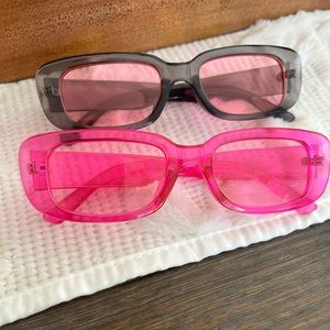 2 pairs of pink sunglasses